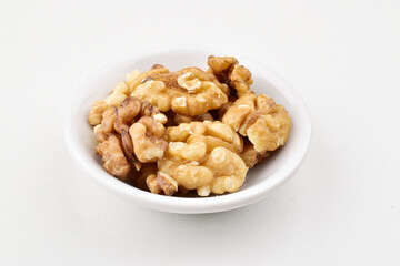 Closeup of walnut seeds on white background
