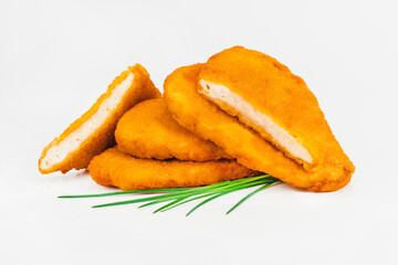 Breaded Chicken Inner Fillet on a White Background,Chicken Breaded Raw Meat.Chicken Breaded Fillet.Fast food. Fast cooking. Breaded chicken nuggets. Homemade food at home.