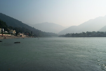 Beautiful morning view of ganga river and mountain at rishikesh, uttarakhand