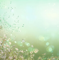Fototapeta na wymiar Romantic spring background with pastel green grass, flowers and musical notes.