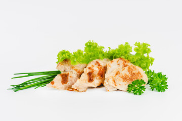 Chicken fillets fried until half cooked, semi-finished product with fresh herbs on a white background. Fast cooking.Fast homemade food.Fast food. Quick cooking at home. Copy space.