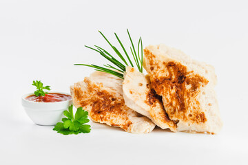 Chicken fillets fried until half cooked, semi-finished product with fresh herbs on a white background. Fast cooking.Fast homemade food.Fast food. Quick cooking at home. Copy space.