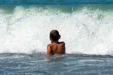 White boy swims in the black sea