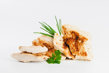 Chicken fillets fried until half cooked, semi-finished product with fresh herbs on a white background. Fast cooking.Fast homemade food.Fast food. Quick cooking at home. Copy space.