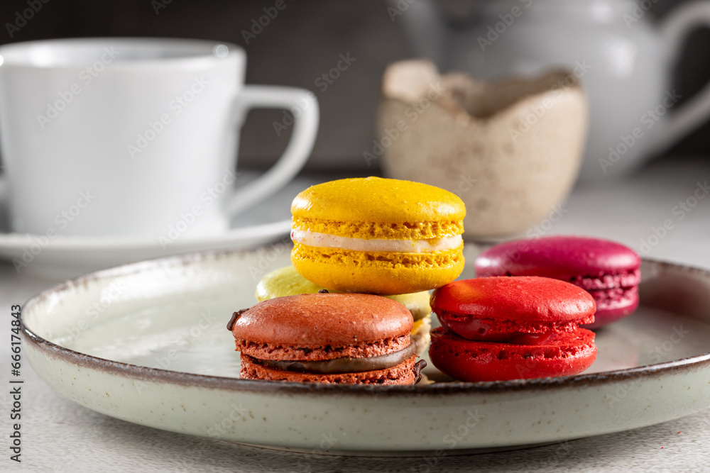 Wall mural delicious macaroons on the table. macarons cakes in different colors.