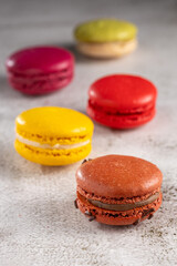 Delicious macaroons on the table. Macarons cakes in different colors.