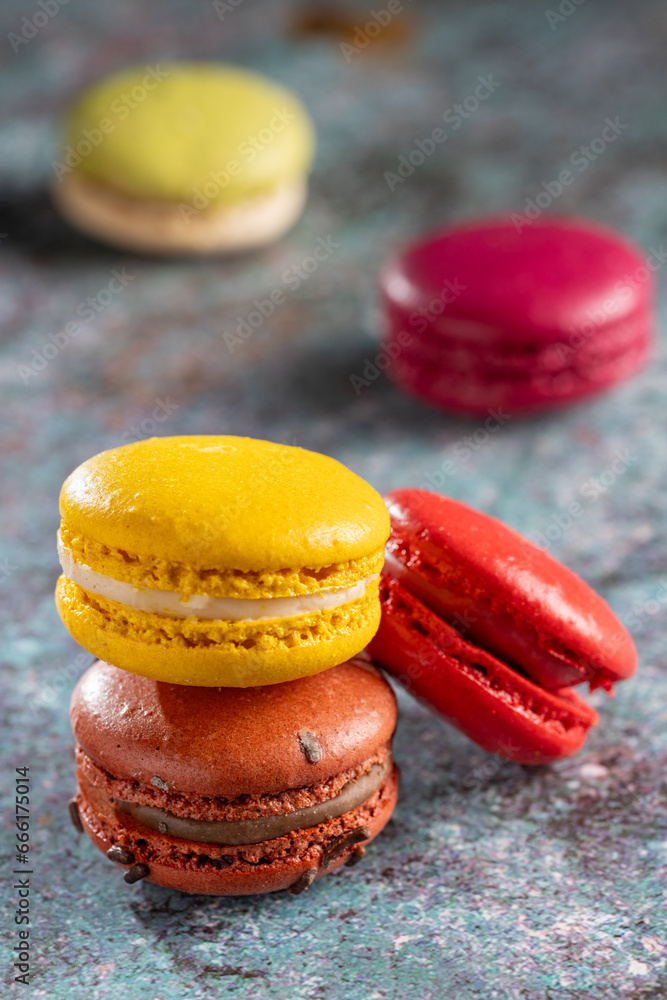 Wall mural delicious macaroons on the table. macarons cakes in different colors.