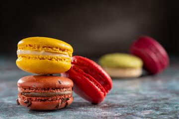 Delicious macaroons on the table. Macarons cakes in different colors.