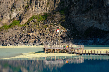 Wooden Pier with Indonesian Flag Inside Kawah Putih Crater