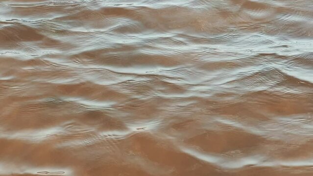 Sea water and sand surface in sunny spring day. 