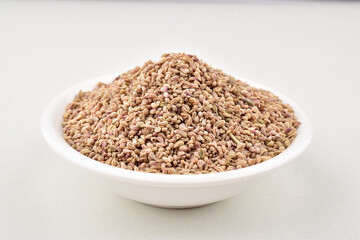 Closeup of carom seeds on white background