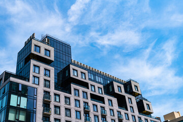 Fototapeta premium modern city building. skyscraper in metropolis city. city downtown with skyscraper. office building exterior. skyscraper building architecture. skyscraper with facade. modern architecture
