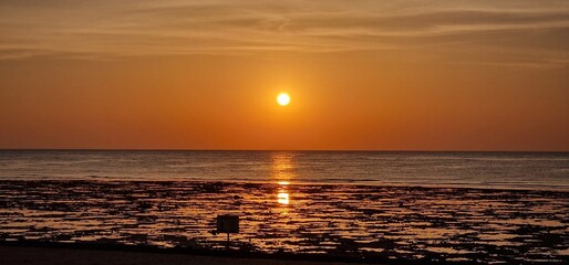 sunrise in early morning hours in egypt close to Marsa alam sun reflexion in the red sea