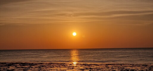 sunrise in early morning hours in egypt close to Marsa alam sun reflexion in the red sea