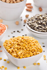 Raw chana dal in bowl on white background