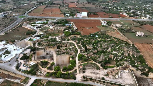 Bird's-eye view of Minorca's historic quarries and surrounding fields.