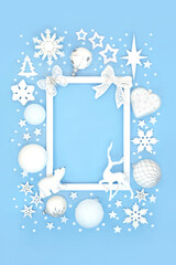 Magical Christmas north pole background border of bauble decorations, white frame and snowflakes....