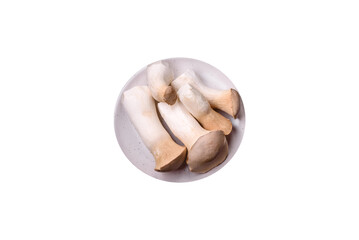 Pleurotus eryngii mushrooms on a dark concrete background