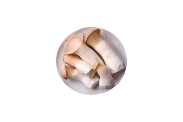 Pleurotus eryngii mushrooms on a dark concrete background
