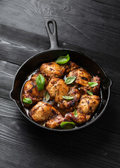 Baked balsamic chicken thighs in cast iron pan