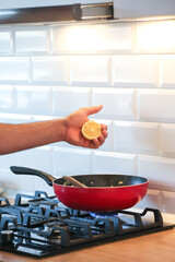 Man cooking in kitchen  hands close-up