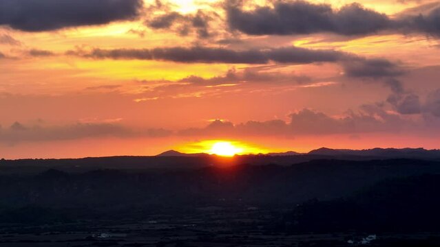Sunset over the tallest hill of Minorca El Tora