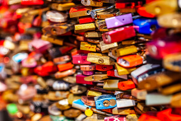 Fototapeta na wymiar Love padlocks by day light on Hohenzollern Bridge in Cologne, Germany.
