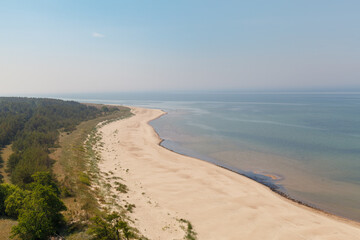Aerial view of the Baltic Sea shore line, Lithuania. Beautiful sea coast on sunny summer day.