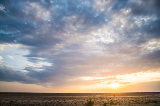 Atmospheric deep sky in the desert of Uzbekistan at sunset in the evening, minimalistic clouds for background