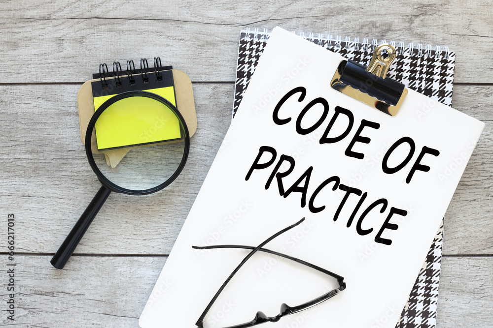 Poster concept image of business acronym cop code of practice. text on white a4 paper. magnifier and sticke