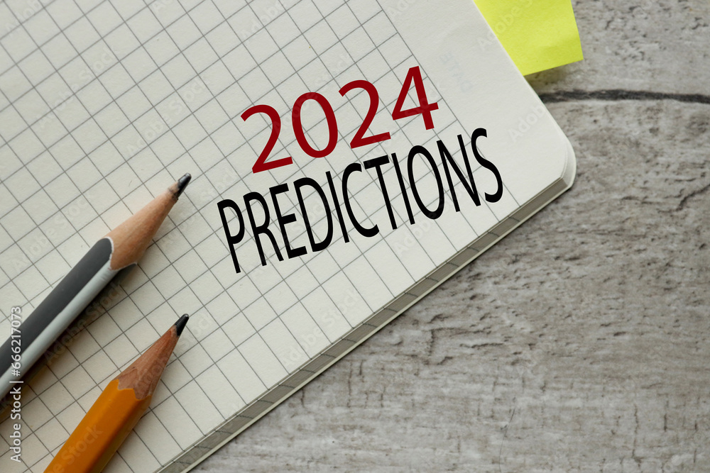 Poster notebook open on a wooden table. words 2024 predictions