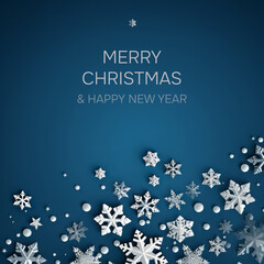 A blue Christmas card with white snowflakes