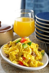 4K Image: Scrambled Eggs with Sausage and a Refreshing Glass of Juice