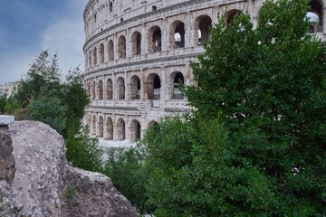 Fototapeta na wymiar Glimpse of the Colosseum (Colosseo, Anfiteatro Flavio) in Rome, Italy 