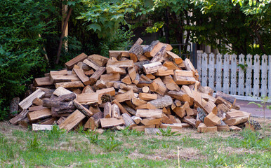 Wooden stack on the green grass outside