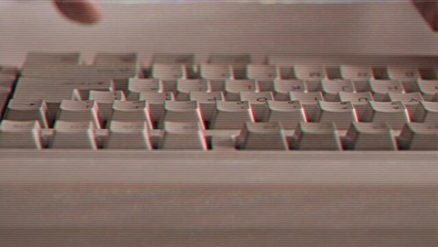 Computer engineer developer is working on old vintage computer 1990s. Antique classic pc keyboard and programmer typing hands. Internet web digital startup history. Outdated retro technology concept