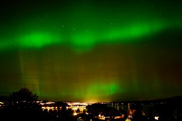 Idyllic night scene of Tromso, Norway featuring the stunning Northern Lights