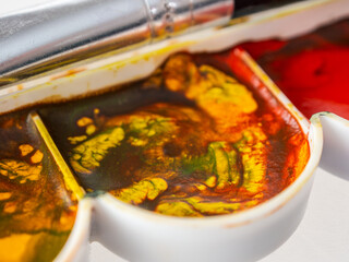 Artistic palette of watercolor paints for learning to draw with artistic skills