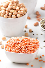 Closeup of red lentils bowl on white background