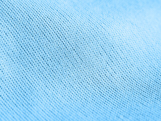 Factory textile fabric material surface blue colored background with thread