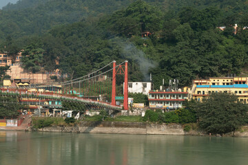 Fototapeta premium Ram jhula bridge view ganga river and green mountains