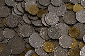 A pile of Swiss Franc (CHF) coins to showcase the increasing cost of living and the reducing amount...