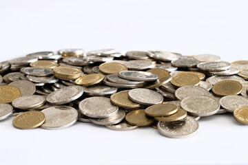 A pile of Swiss Franc (CHF) coins to showcase the increasing cost of living and the reducing amount of savings and earnings