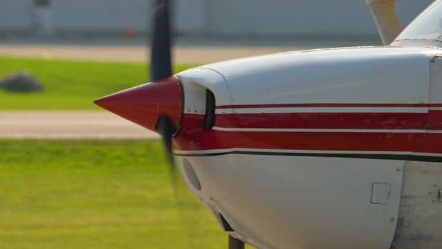 Plane engine with working propeller. Departure warm up of a small aircraft. Private single engine airplane at Municipal Airport. Flying pilot lessons and flight training for recreational pilot permit.