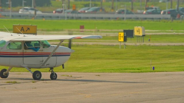 Flying pilot lessons and flight training for recreational pilot permit. Plane engine with working propeller. Departure warm up of a small aircraft. Private single engine airplane at Municipal Airport.