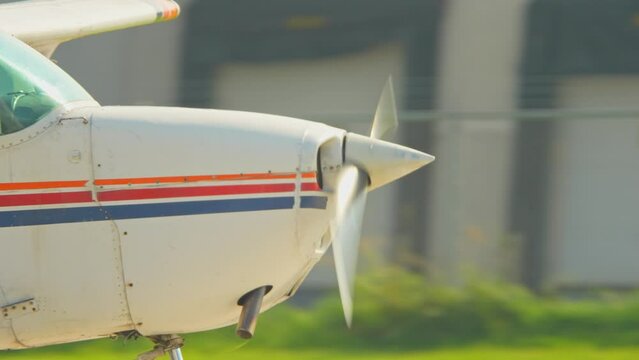 Flying pilot lessons and flight training for recreational pilot permit. Plane engine with working propeller. Departure warm up of a small aircraft. Private single engine airplane at Municipal Airport.