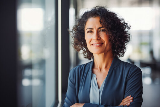 Successful Mature Hispanic American Woman Portrait Walking In Business Building. Mature Confident Business Woman In Business Environment Building.