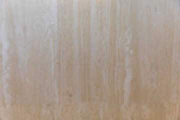 A White and Cream Colored Wall of Yellowstone Travertine with a Wood Grain Pattern 