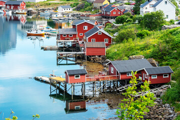 Reine, fishing village with red rorbu cottages, Lofoten islands, Norway. The Norwegian fishing hut...