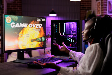 Gamer feeling irked after losing singleplayer action videogame mission, being outsmarted by...